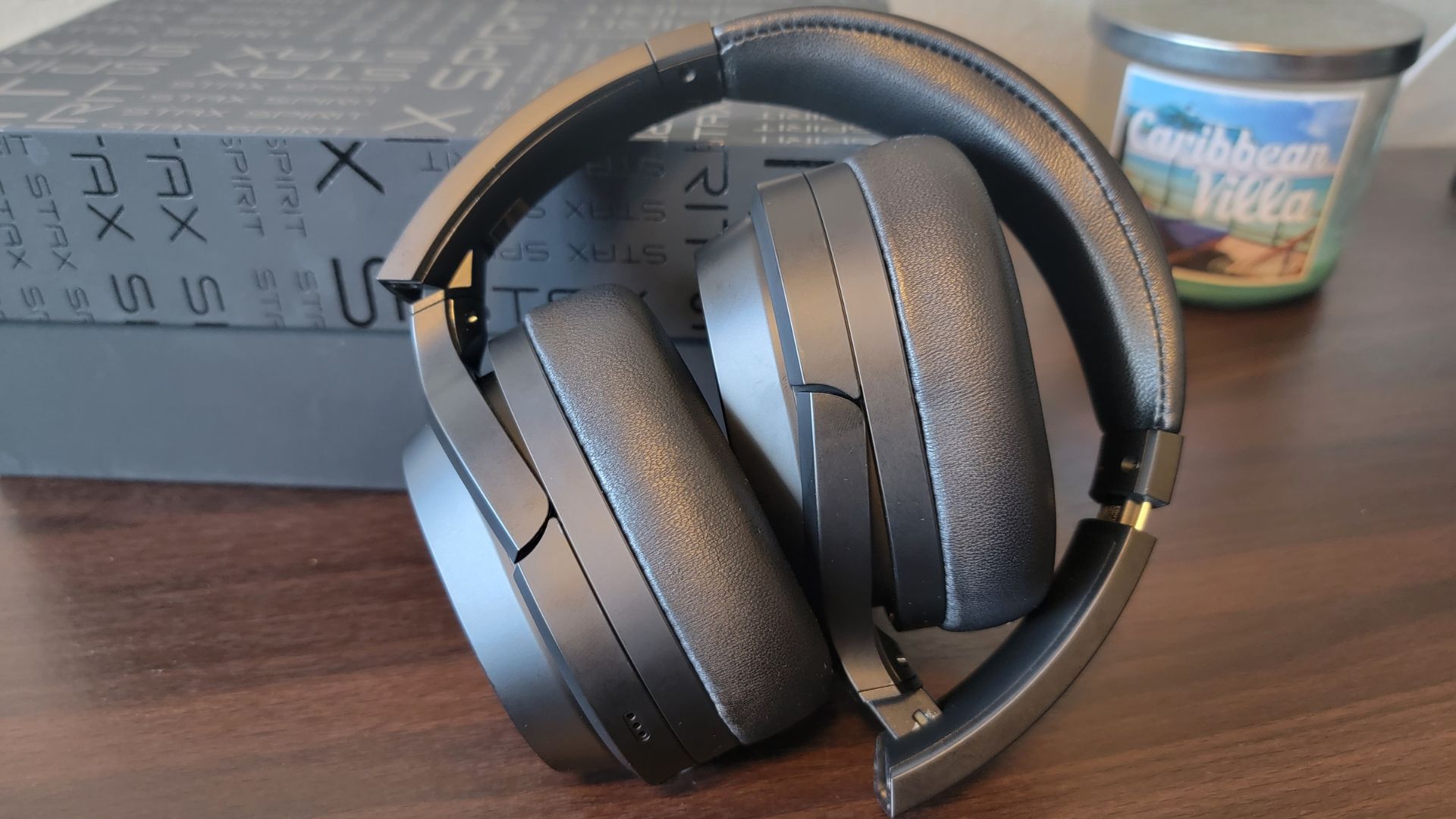 edifier stax spirit s3 planar magnetic headphones folded up compactly on a wooden desk