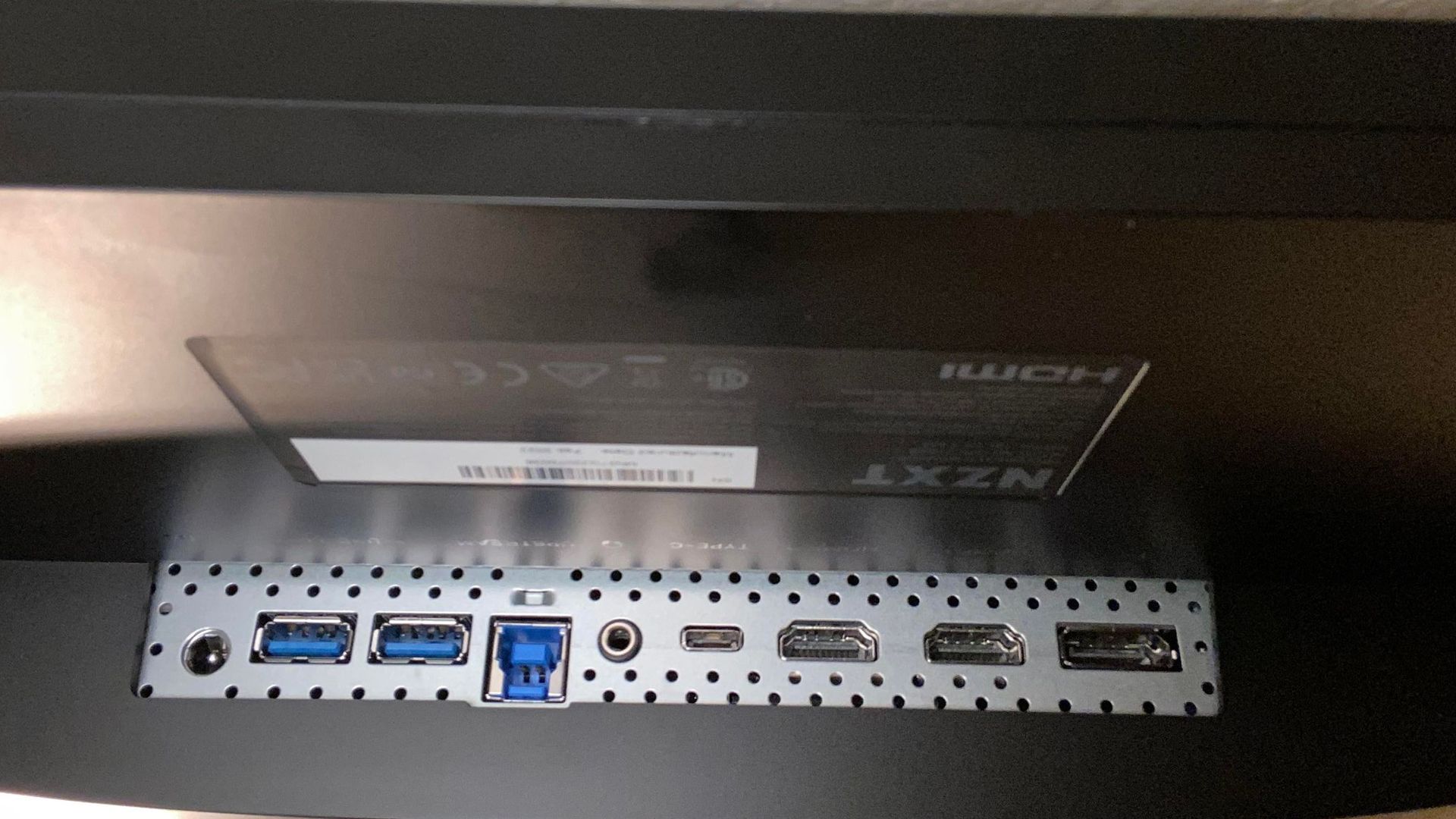 Rear of the NZXT Canvas 27Q showing various ports and connections