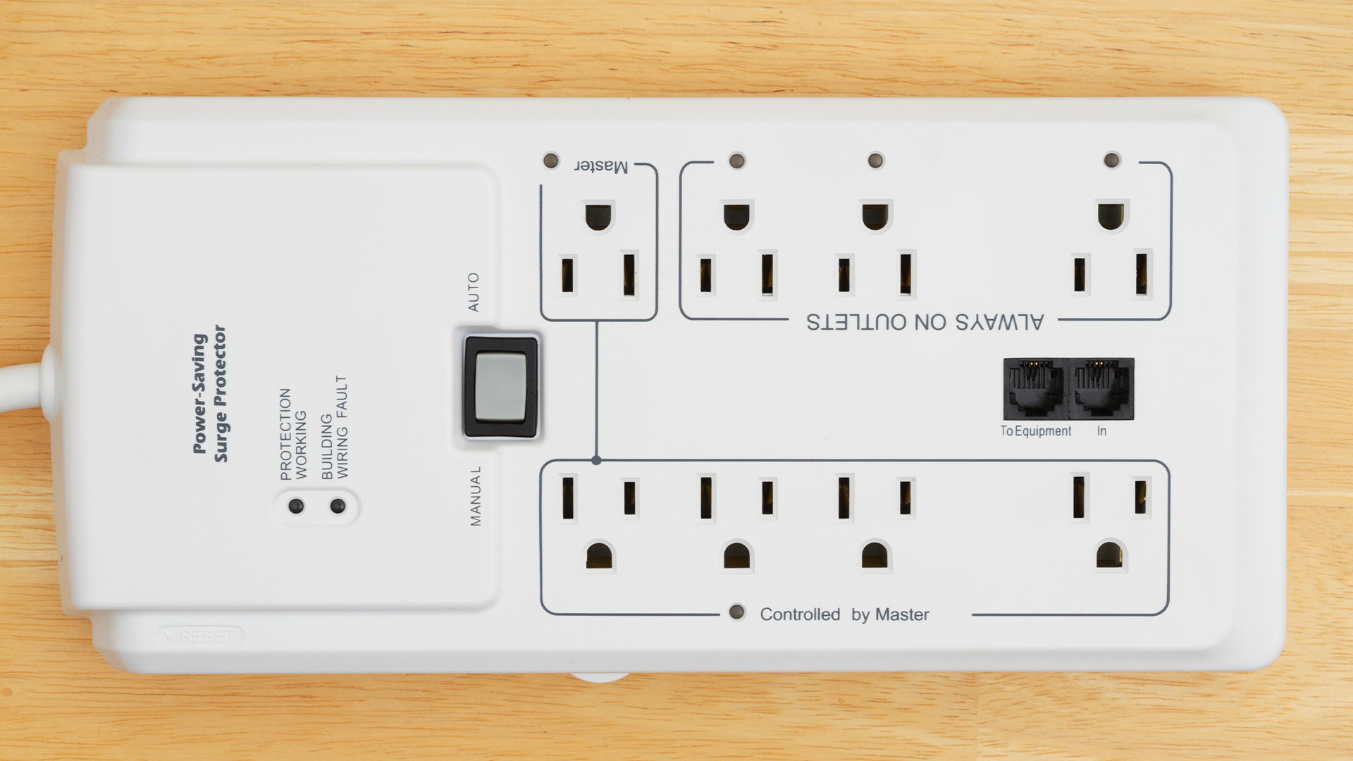 A big white surge protector on a wooden floor.