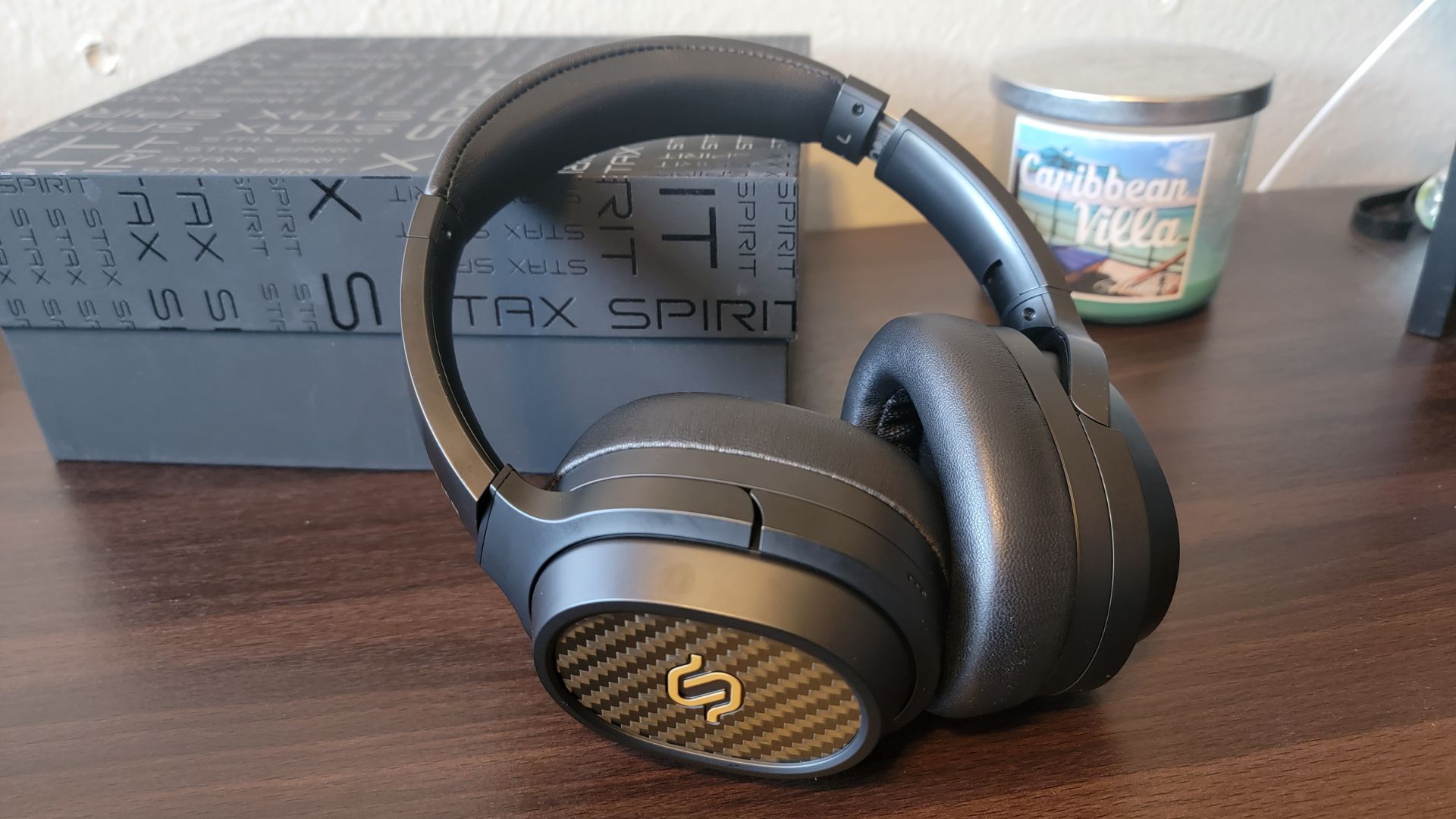edifier stax spirit s3 planar magnetic headphones propped up on the box it came in on a wooden desk