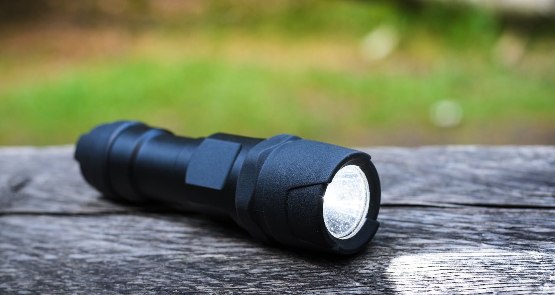 An LED flashlight on the ground