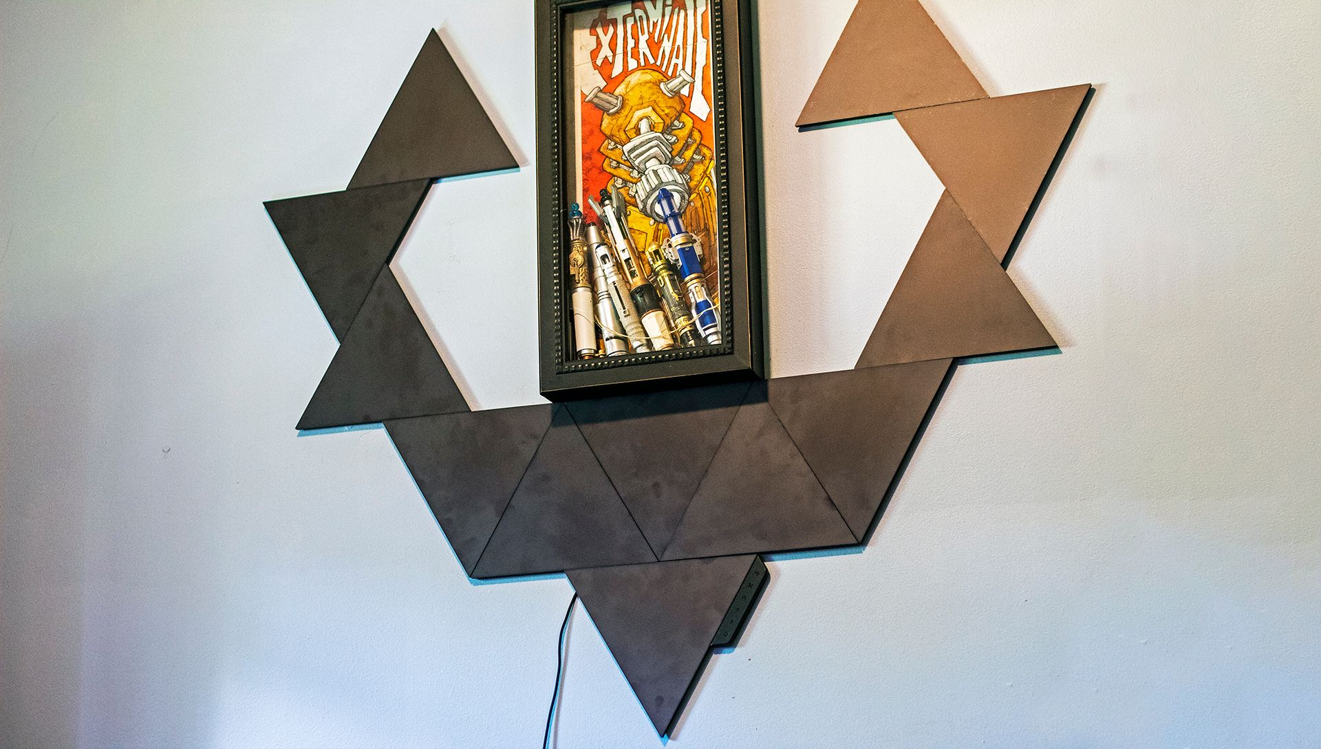 A set of black triangles on a wall