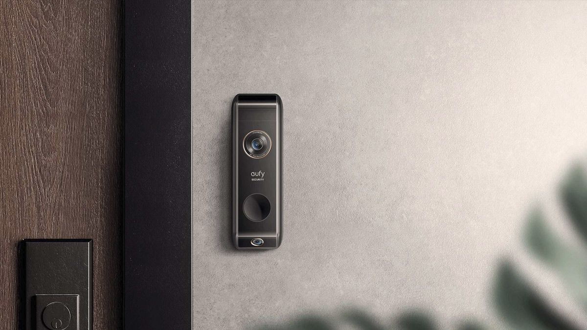 A Eufy doorbell, installed outside a modern apartment.