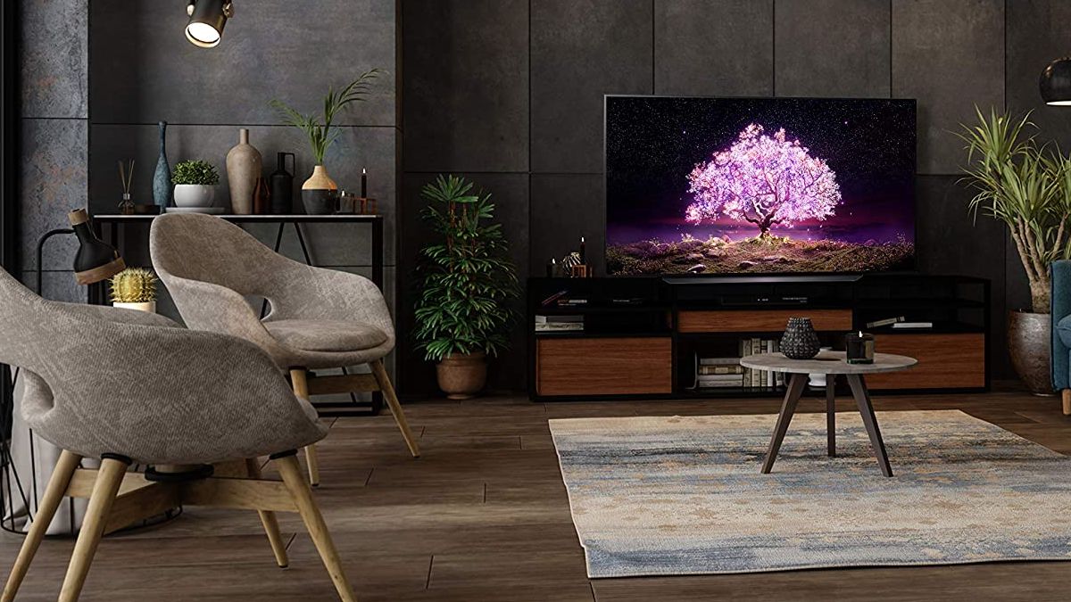 LG OLED C1 sitting on an entertainment center in a living room