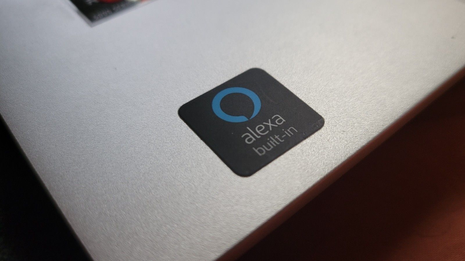 An Alexa Built In sticker on a laptop