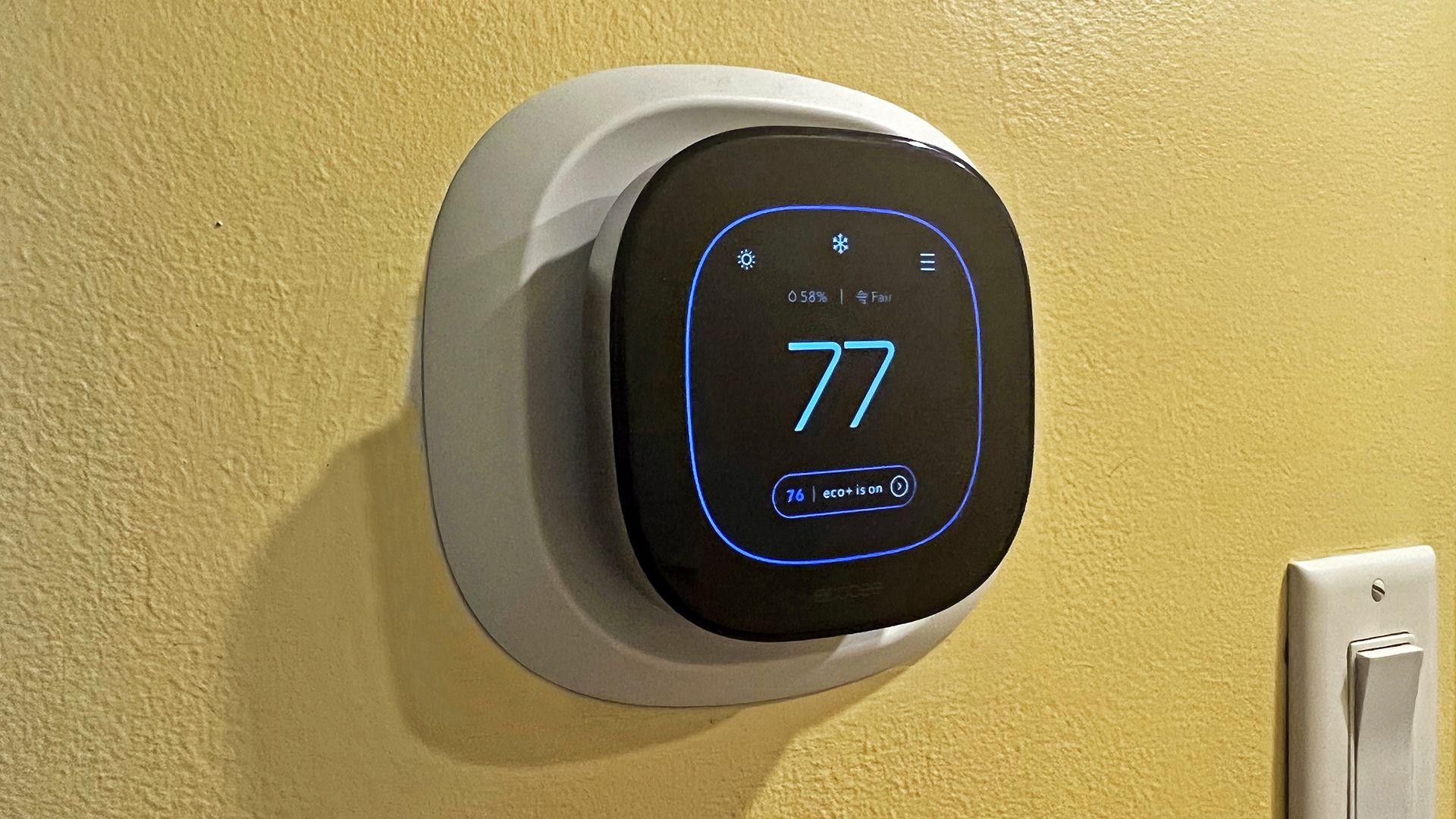 An ecobee thermostat in a hallway