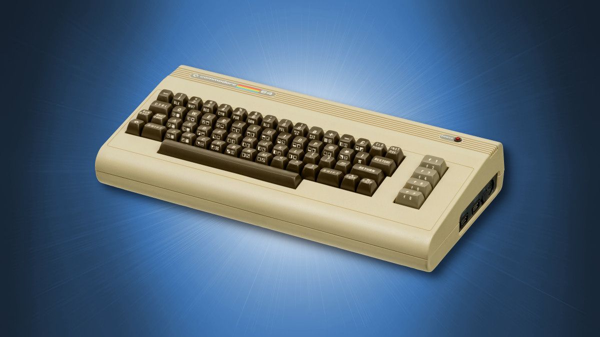 A Commodore 64 home computer on a blue background