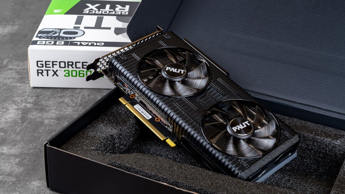 A Palit NVIDIA Geforce RTX 3060 Ti graphics card in an open box against dark background.