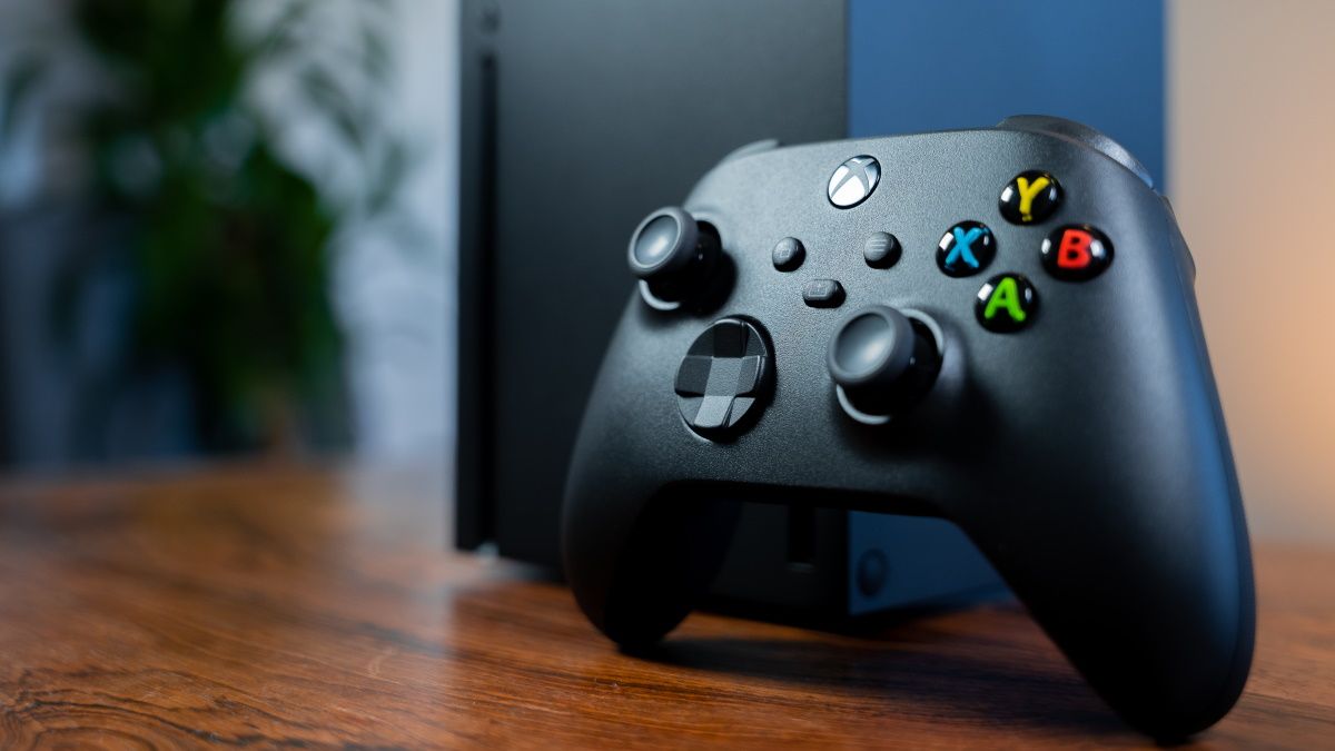 An Xbox Series X and its controller.