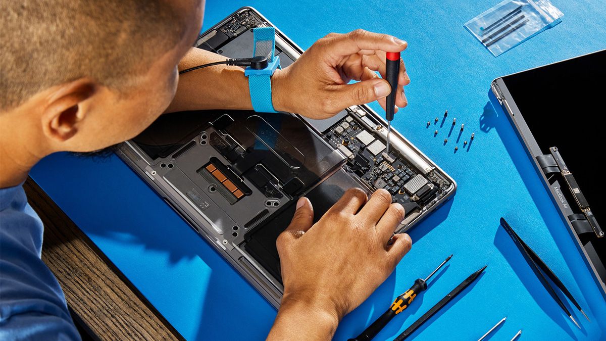 Picture of someone repairing a MacBook Air