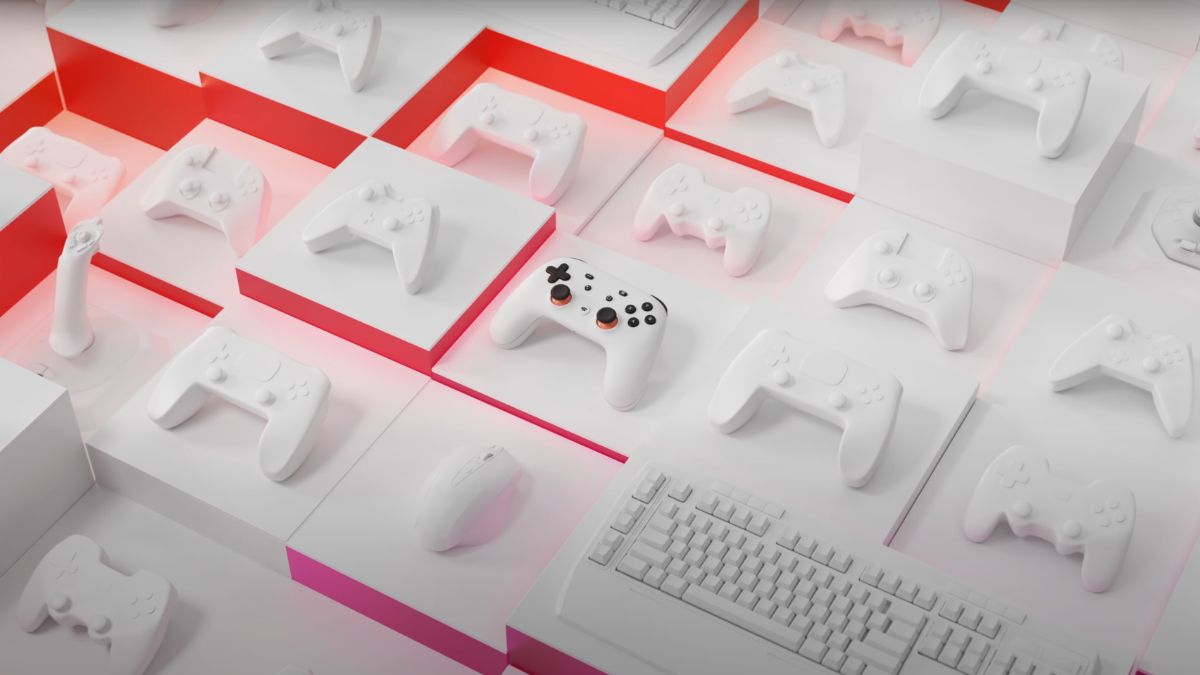 Google Stadia Controller Sitting Among Blank Controller and Keyboard Shells