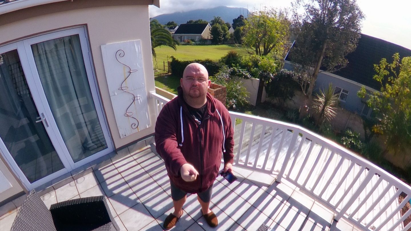 An image of a man taken with a Theta Z1 camera where the selfie stick is invisible
