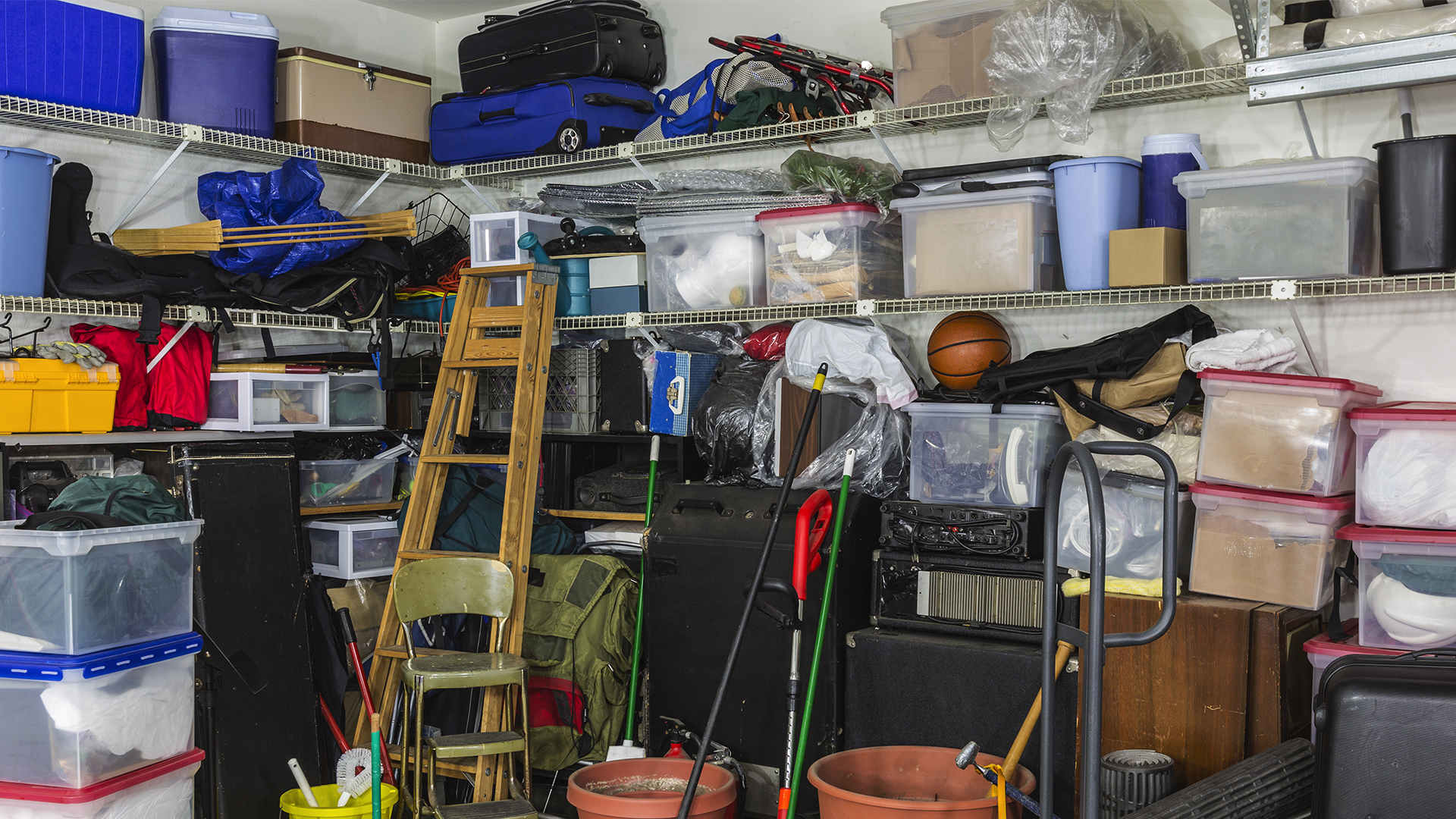 A messy garage filled with crap.