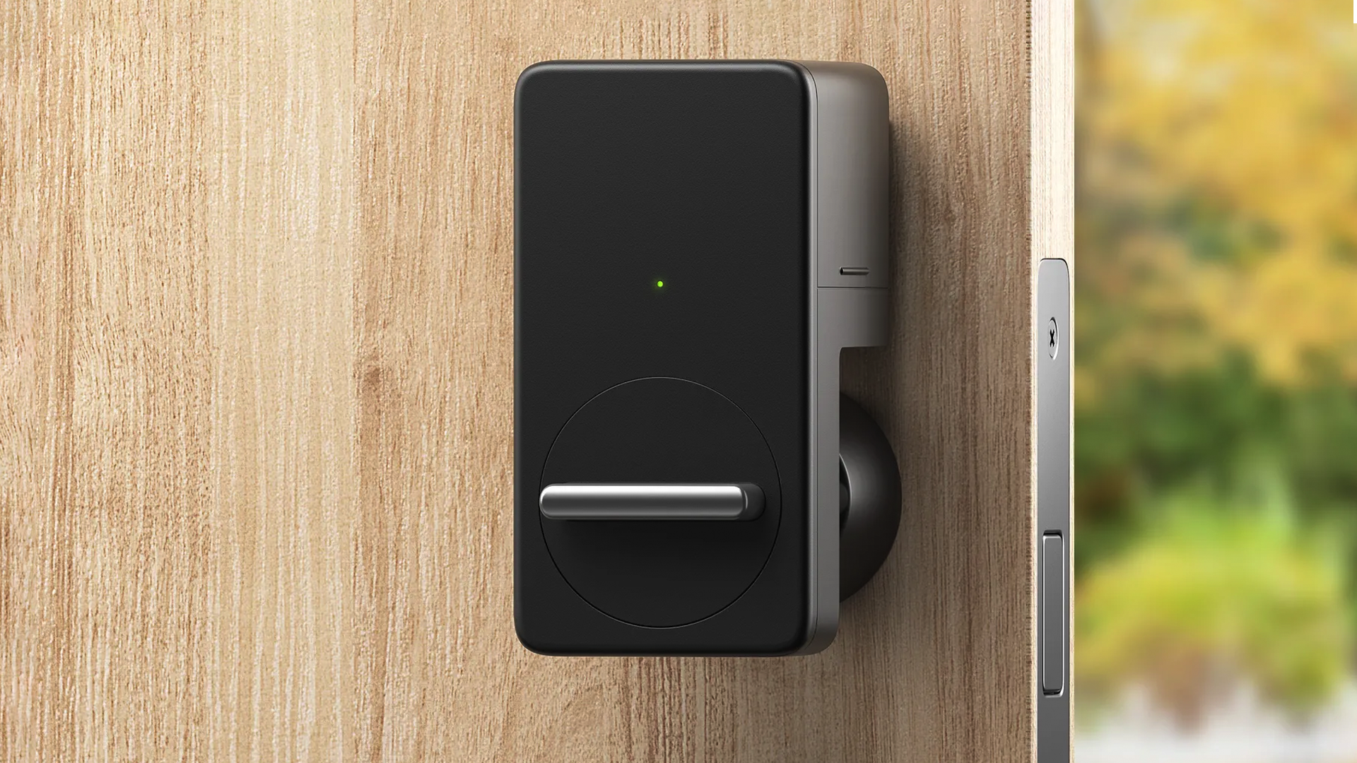 The SwitchBot Wi-Fi smart lock on a door.