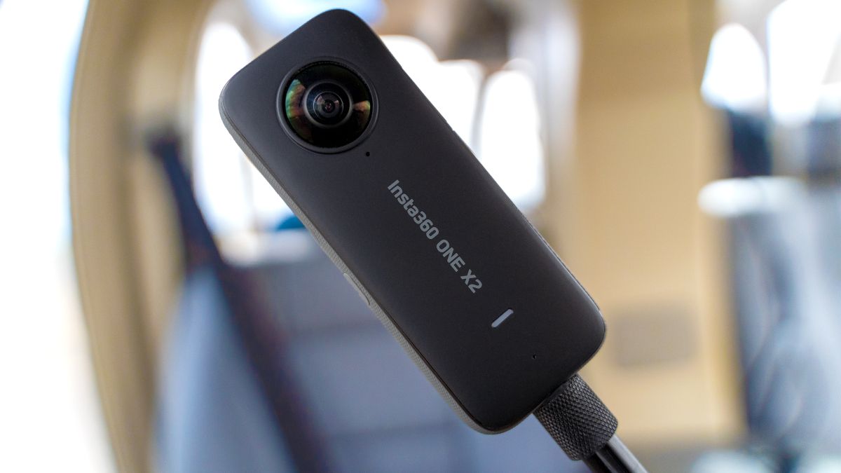 The ONE X2 360 degree action camera by Insta360 on a black selfie stick.