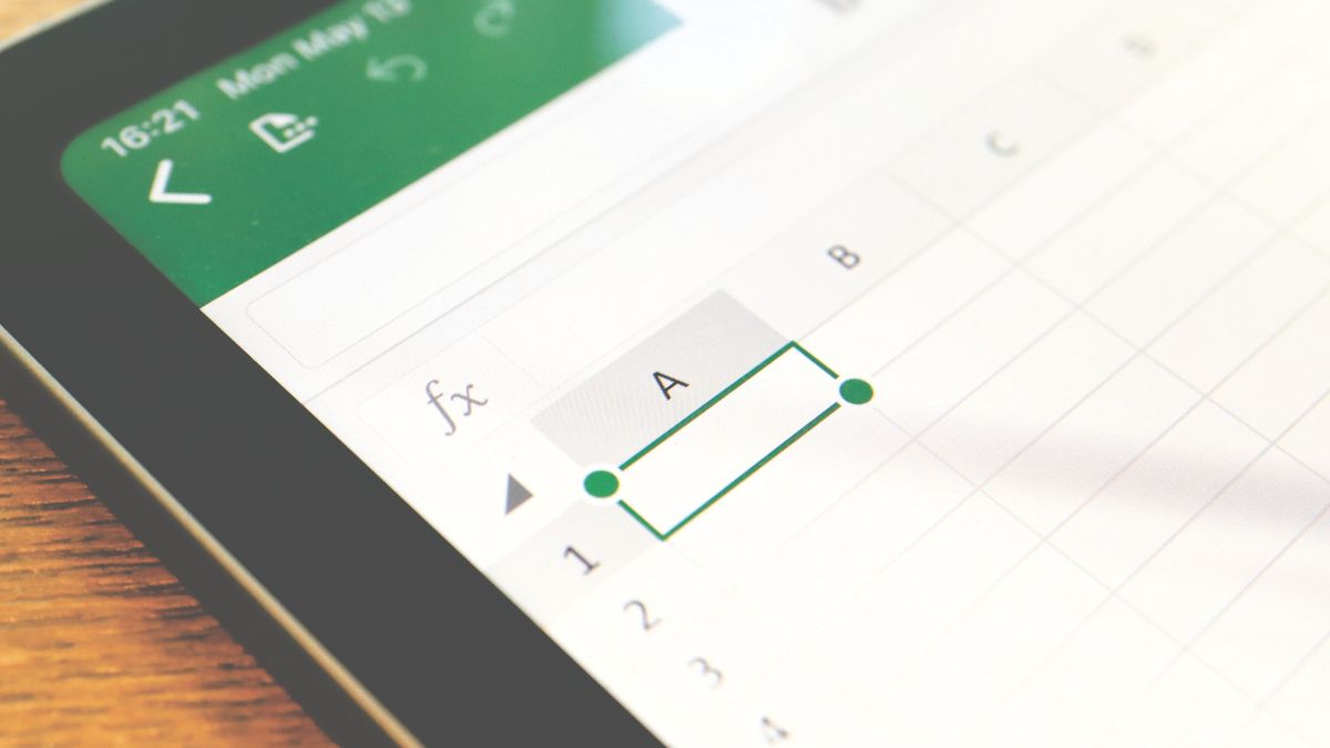 Closeup of the corner of an Apple iPad device with the Excel mobile app visible on screen.
