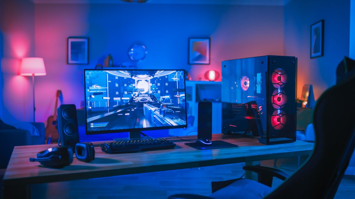 Powerful personal computer gaming rig in a room with RGB lighting.