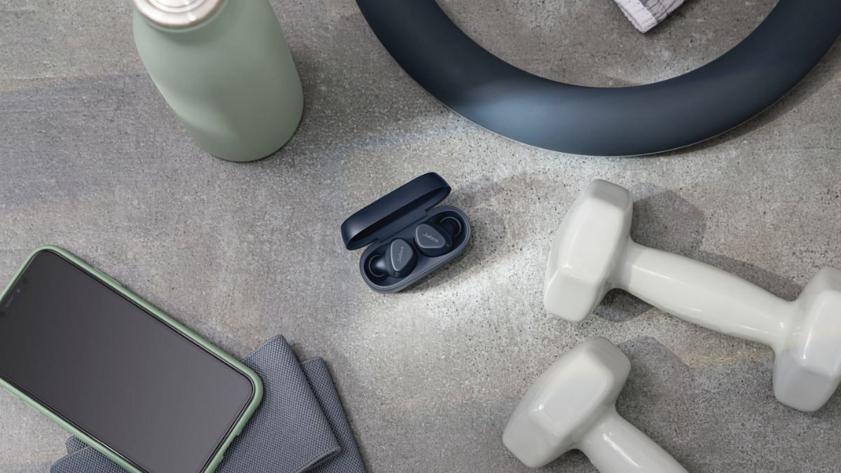 Jabra Elite 4 Active Wireless Earbuds laying among workout equipment