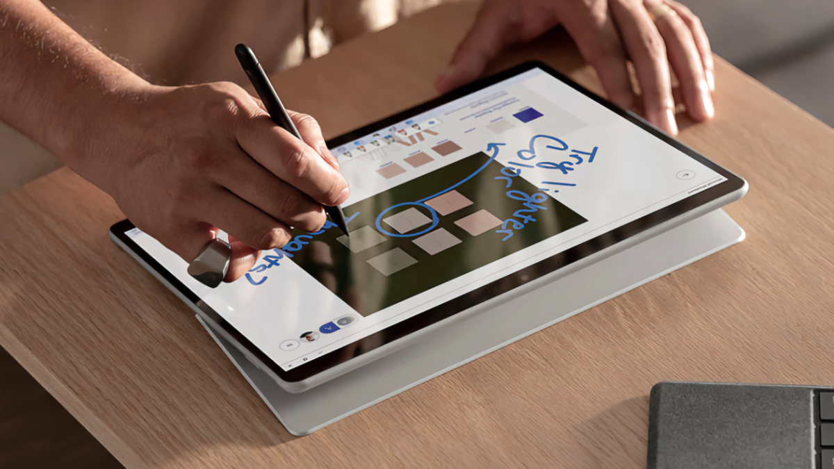 Person using a Slim Pen 2 to draw on a Microsoft Surface Pro X