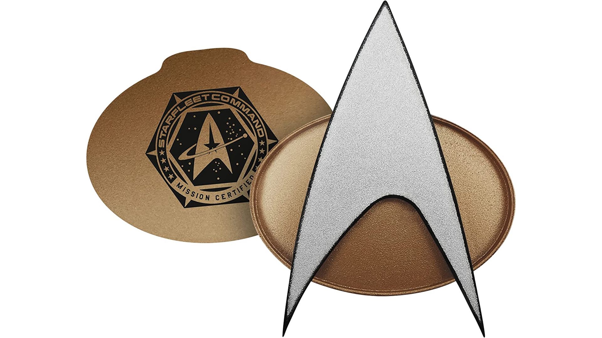 A Star Trek: The Next Generation combadge on a white background.