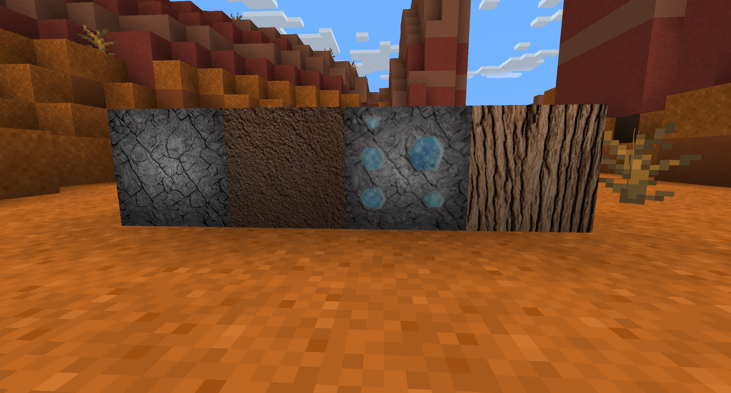 Our textures displayed in Minecraft. From left to right: Stone, Dirt, Diamond Ore, Oak. 