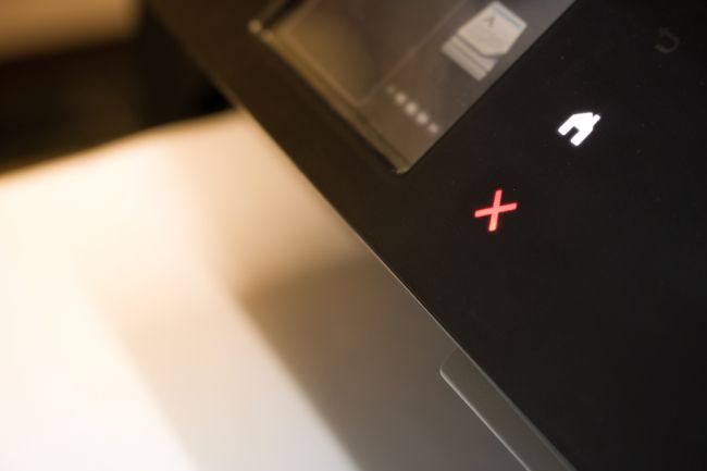 A red error light on an office printer.
