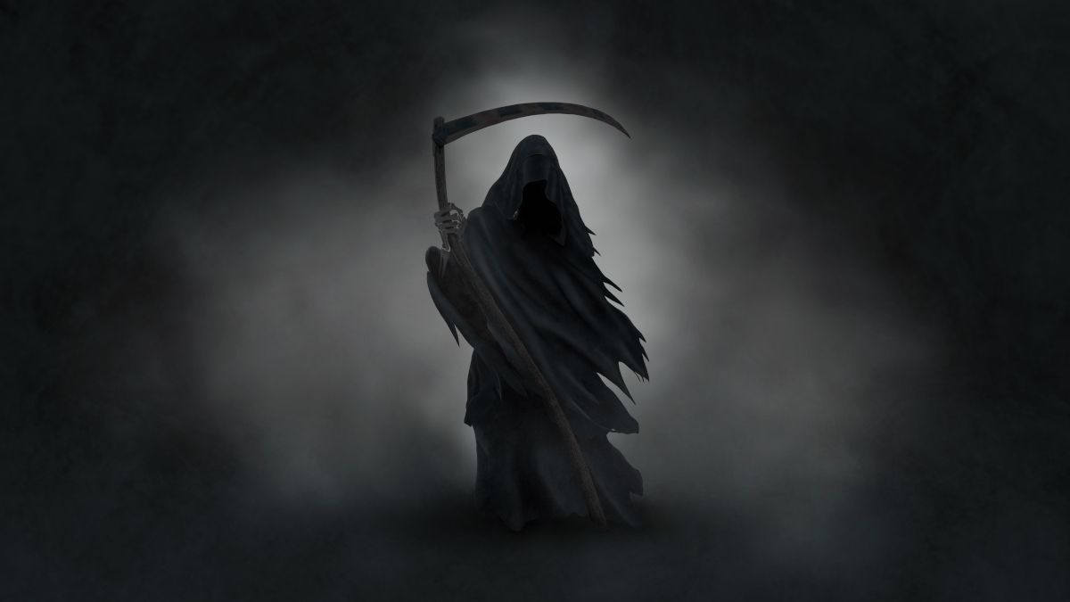 Silhouette of the grim reaper against a cloud of gray fog.