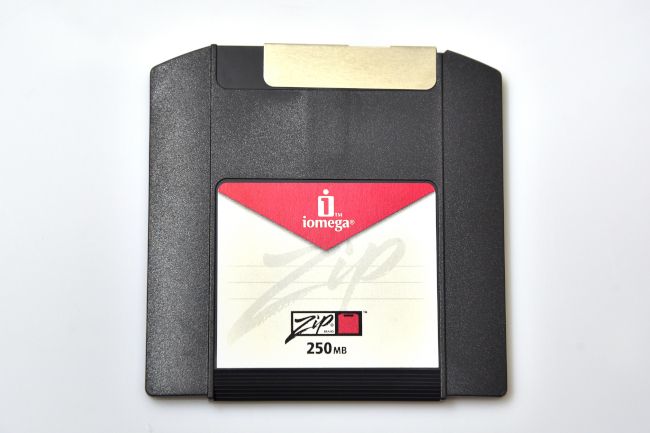 Top-down view of a vintage iomega ZIP drive on white background.