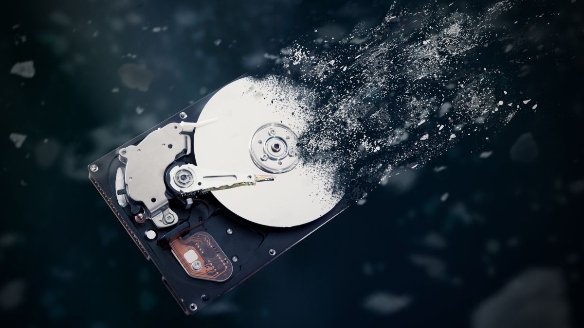 A hard disk drive disintegrating into space.