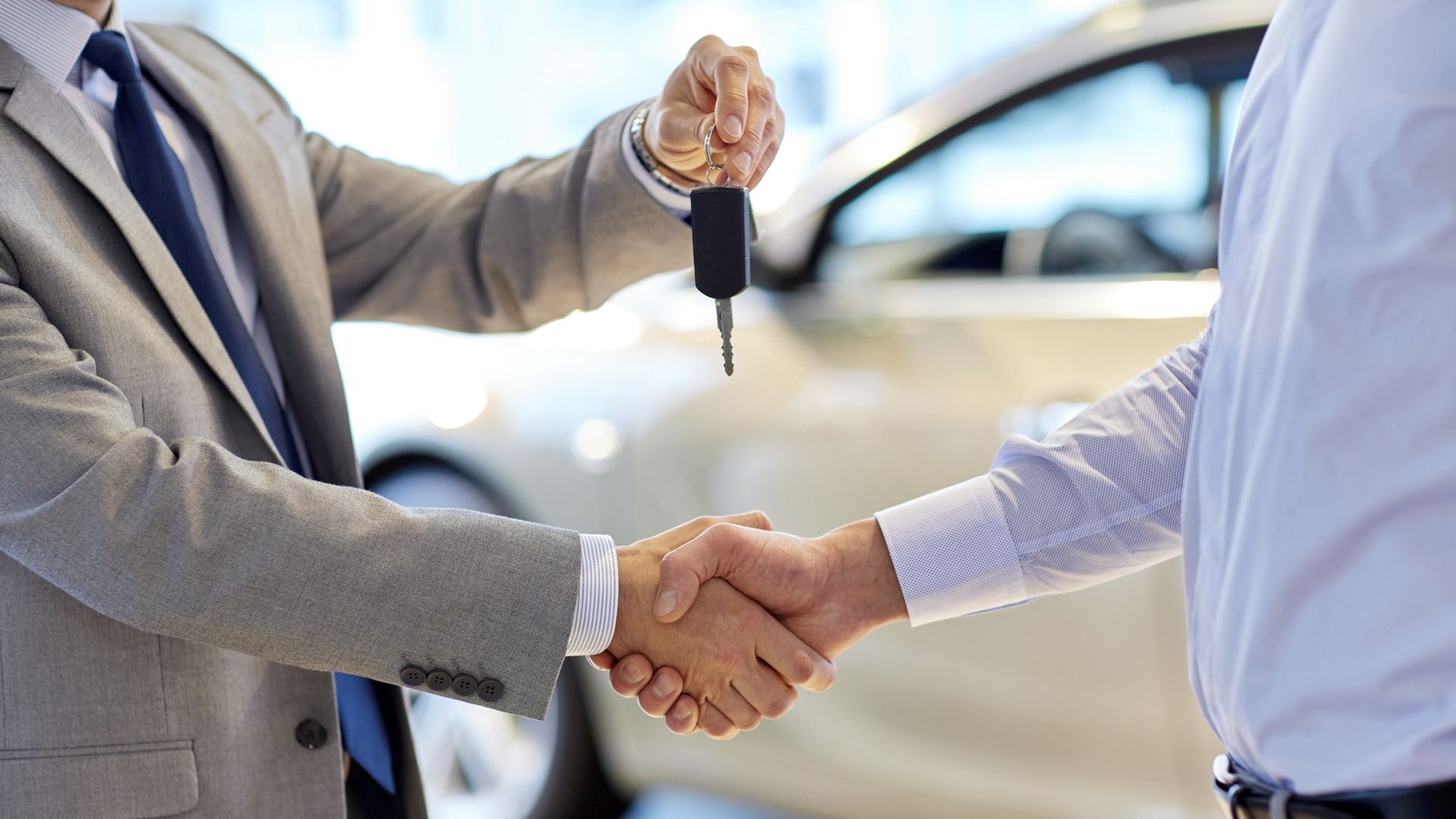 New car sale, man handing over the keys