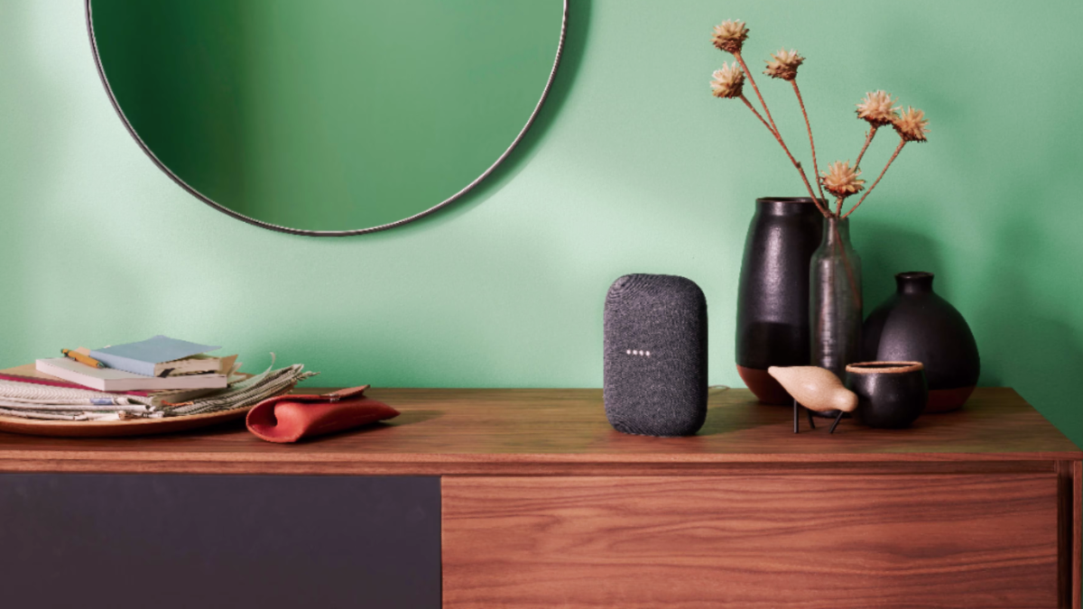 Google Nest Audio smart speaker sitting on a desk