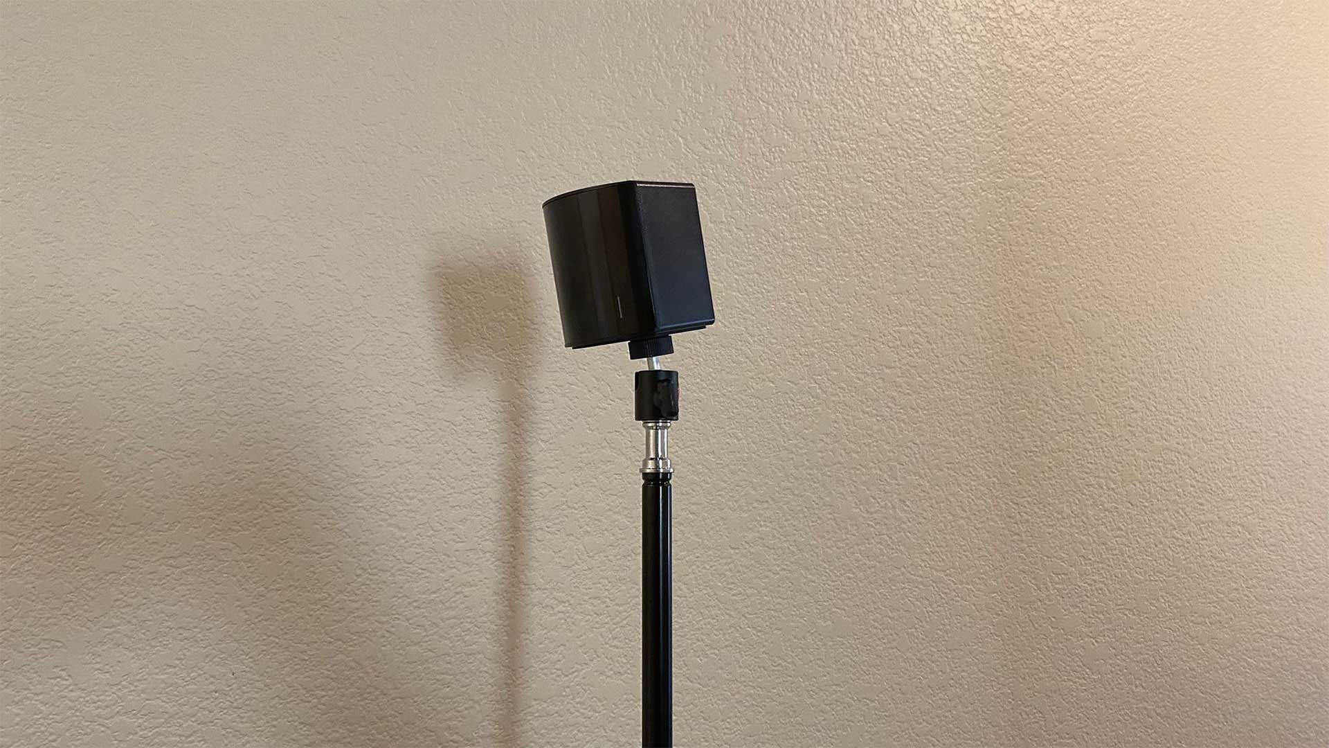 SteamVR base station 2.0 perched on a tripod showing the height requirement.