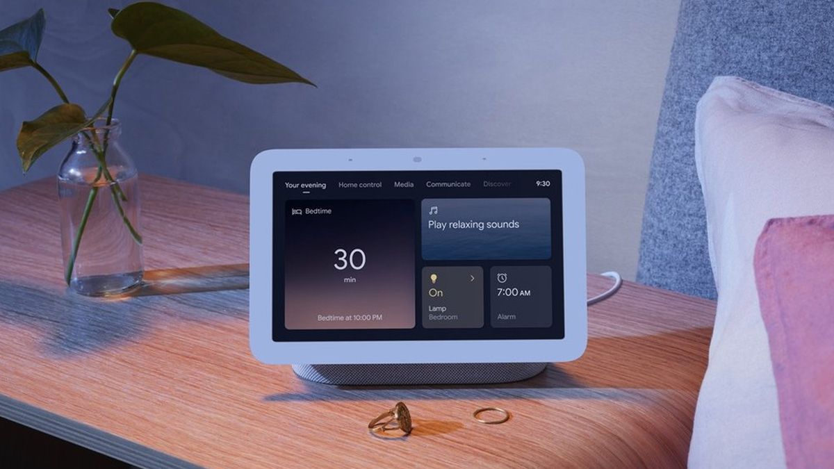 A Nest Hub on a nightstand, doing double duty as a Matter hub.