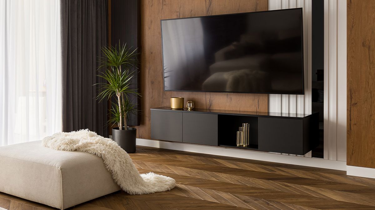 A modern living room with a large flat screen television.