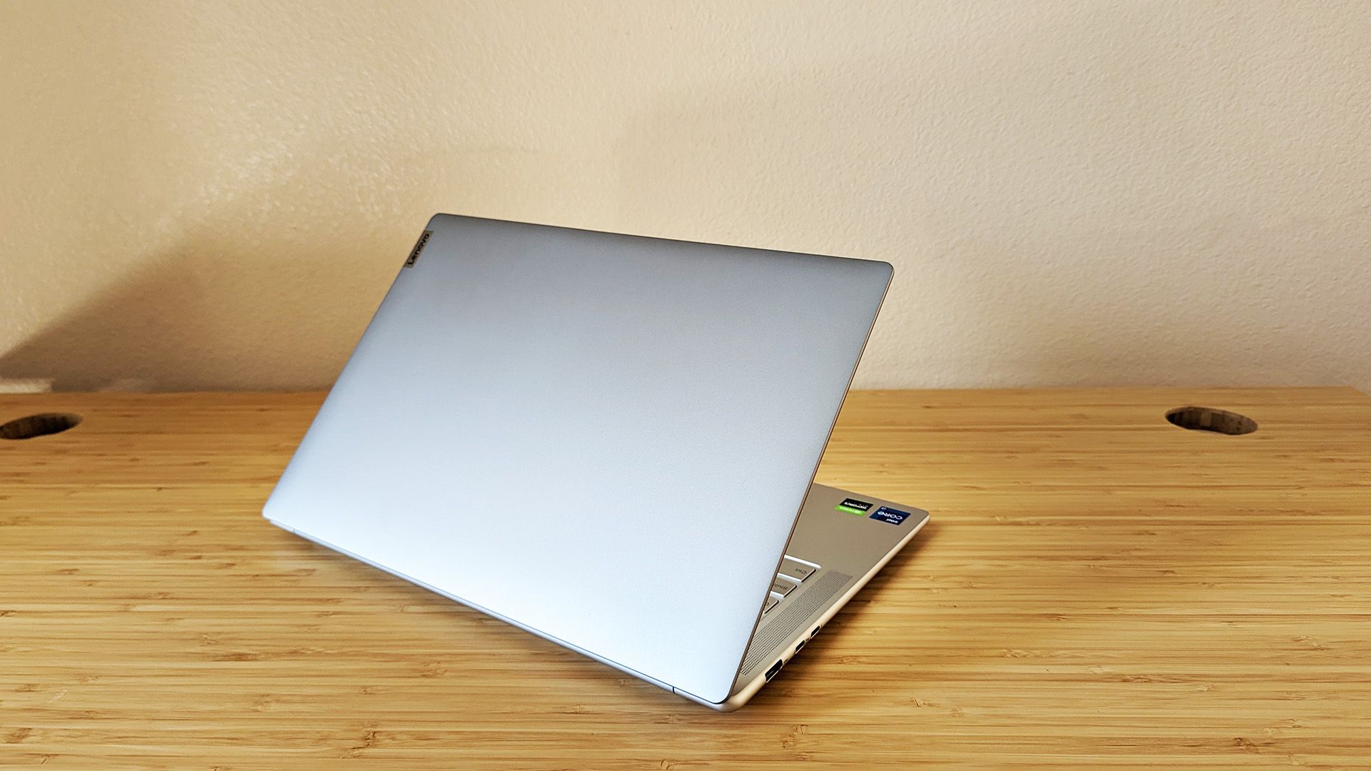 The Lenovo Slim 7i Pro X laptop sitting open on a desk.