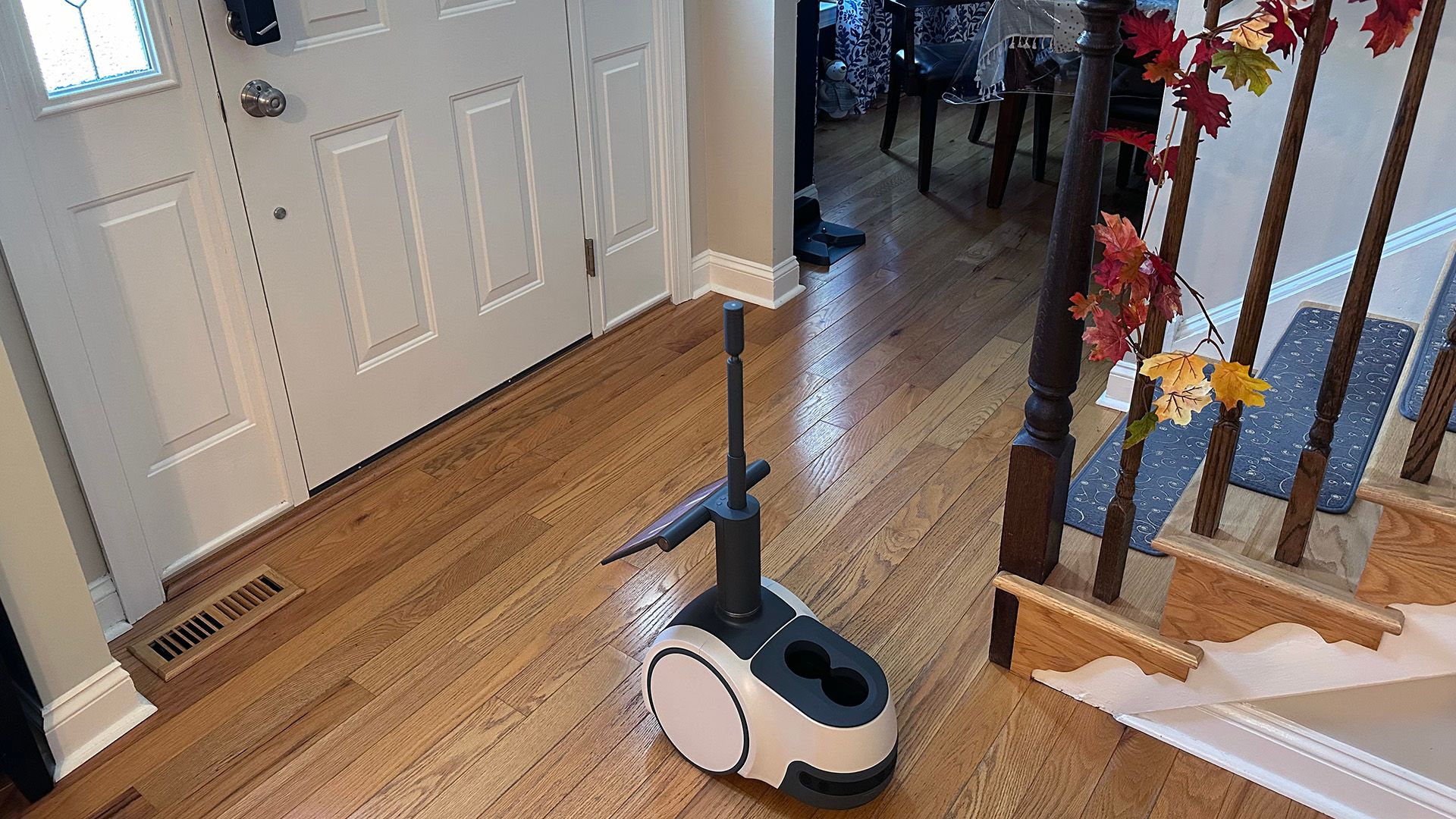 Amazon Astro looking at a front door with its periscope camera