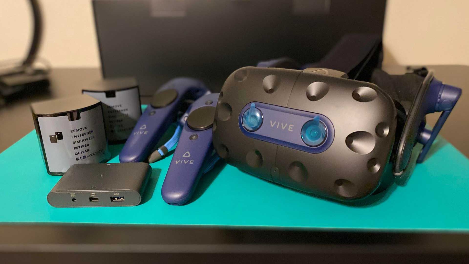 Vive Pro 2 headset with Vive controllers, link box, and Steam VR base stations 2.0