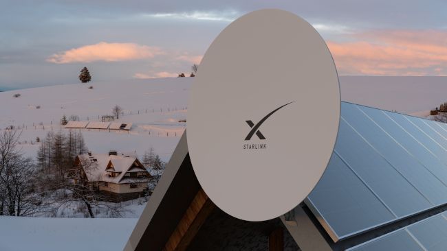 A Starlink internet satellite dish installed on a solar-powered house surrounded by snow.