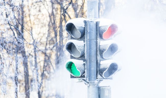Stop light in the snow.