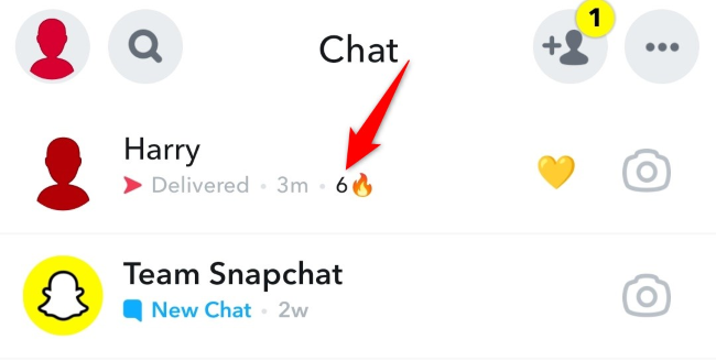 The fire emoji next to a friend's name indicating a Snapstreak is going on.