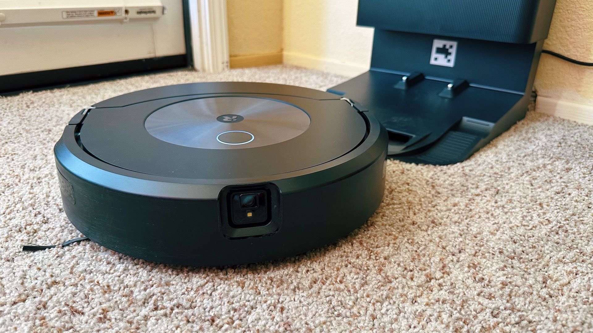 A Roomba robot vacuum begins to clean.