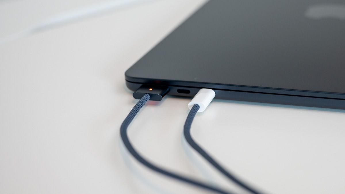 A 2022 M2 Apple MacBook Air being charged with its MagSafe cable