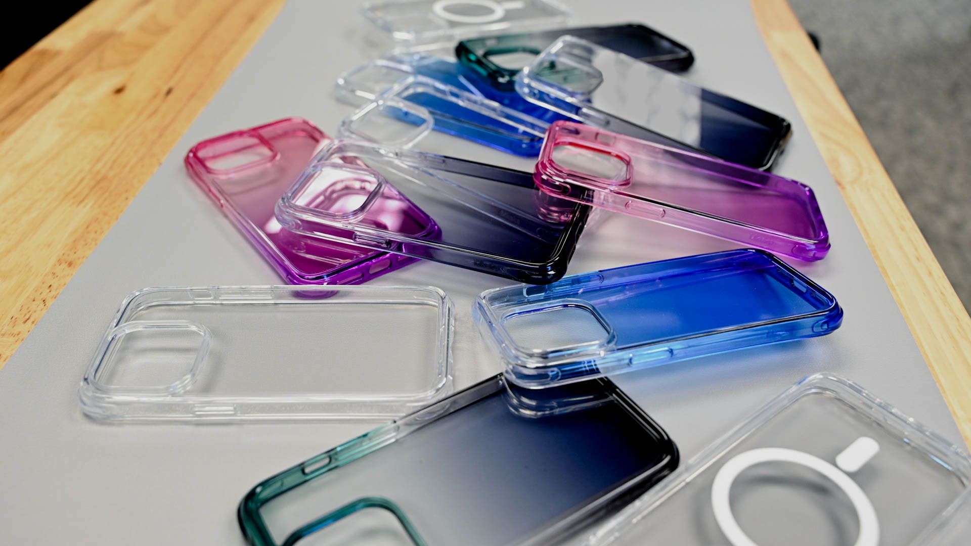 Colorful Mkeke clear iPhone 14 Pro cases lying on a table