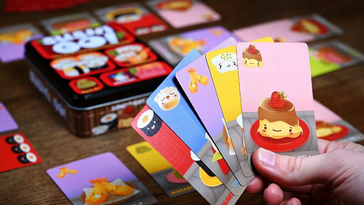 A person playing the card game Sushi Go Party.
