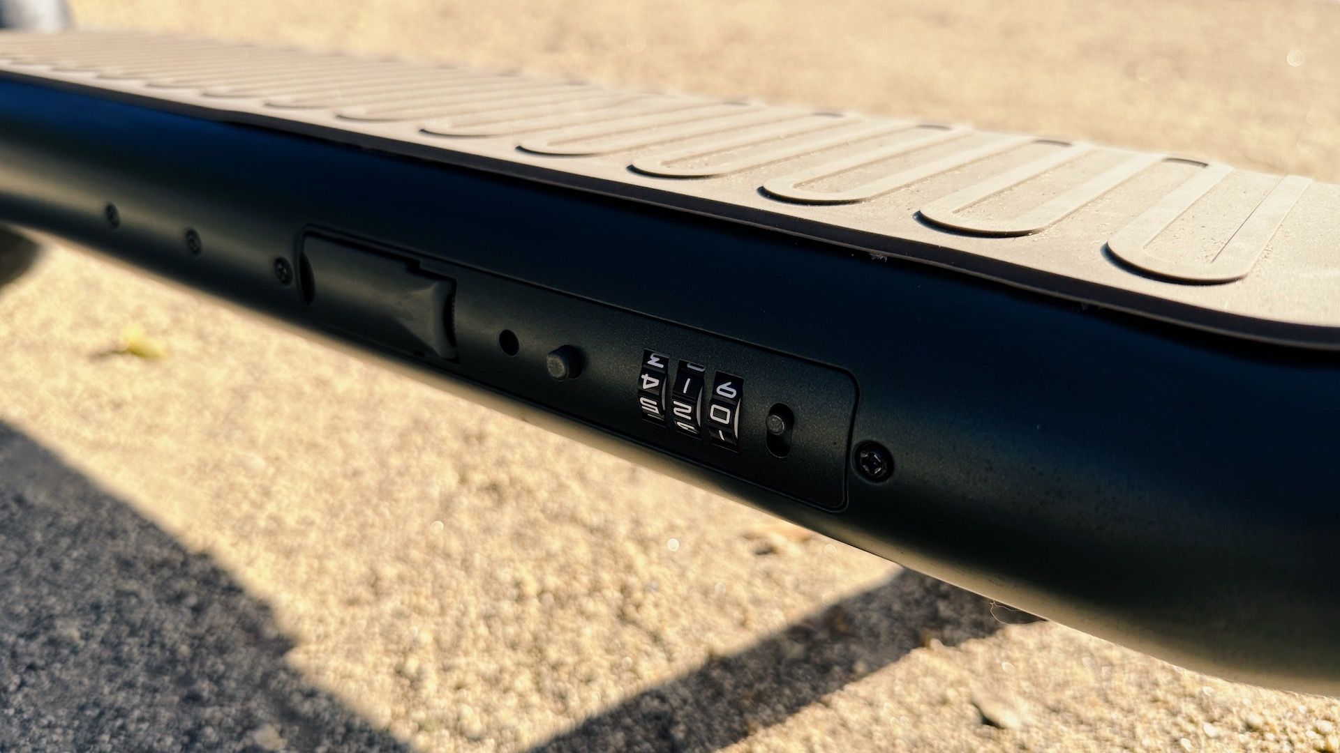 The Atomi Alpha scooter features a built-in combination lock with a pull out wire for securing it.