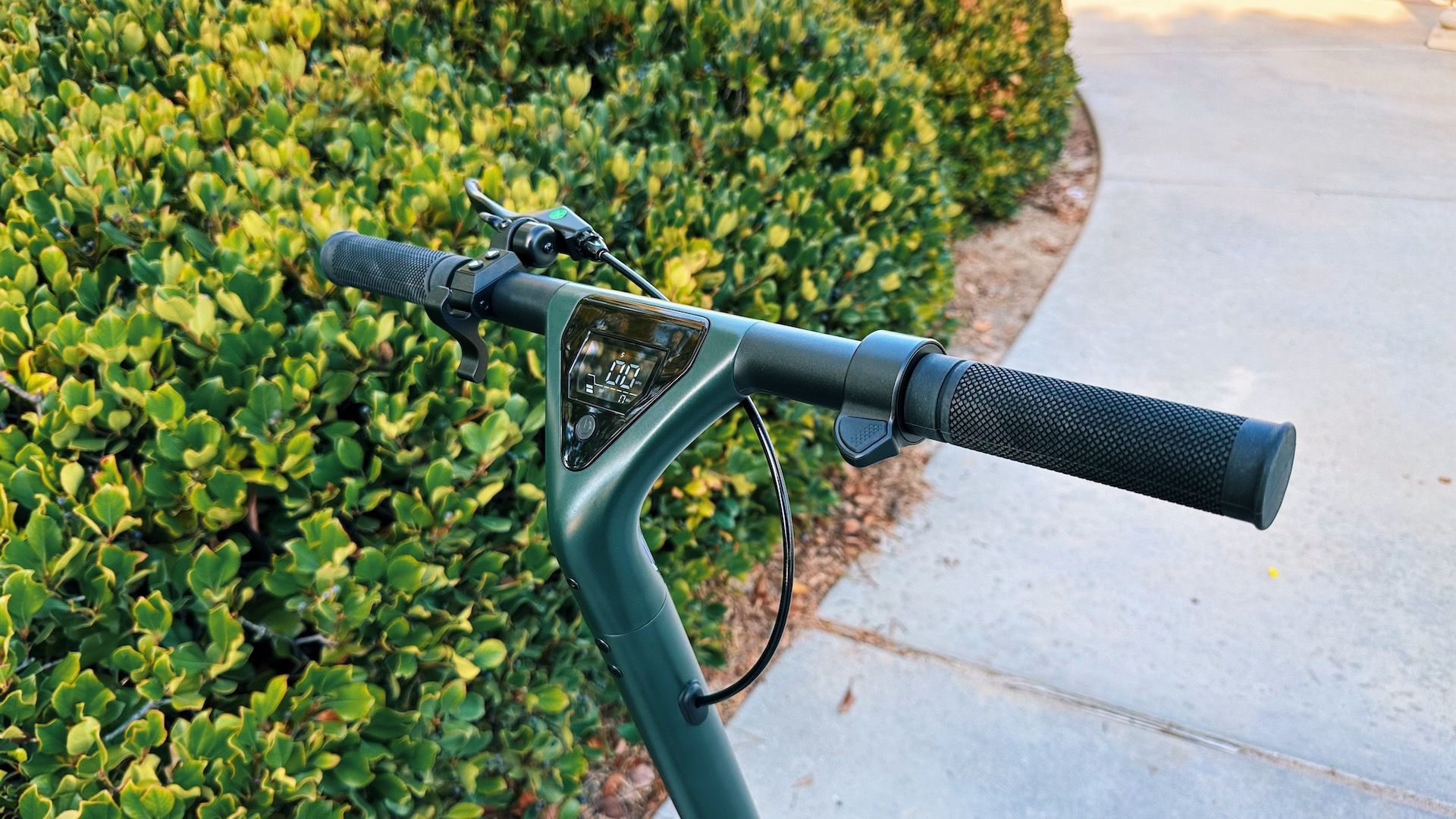 Atomi Alpha electric scooter handlebars showing its screen