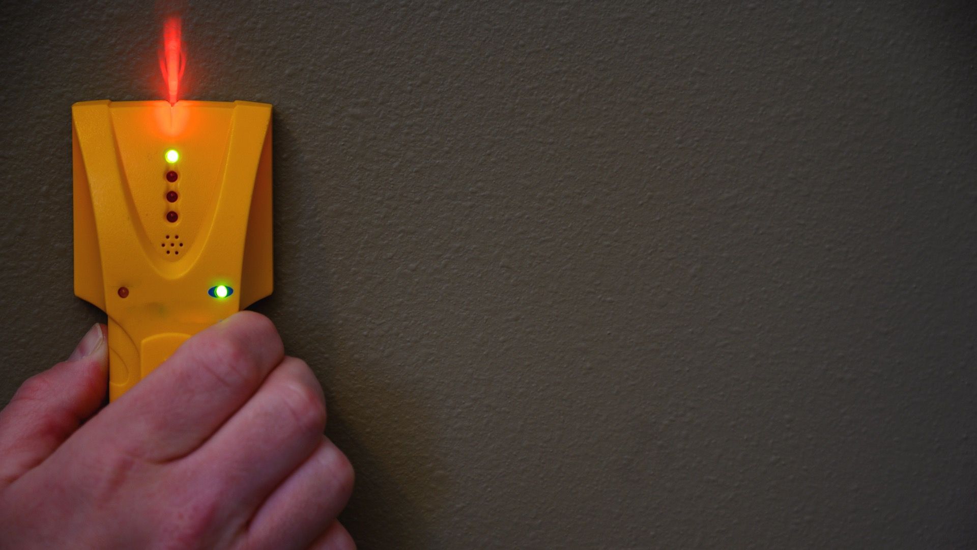 cheap stud finder on a wall
