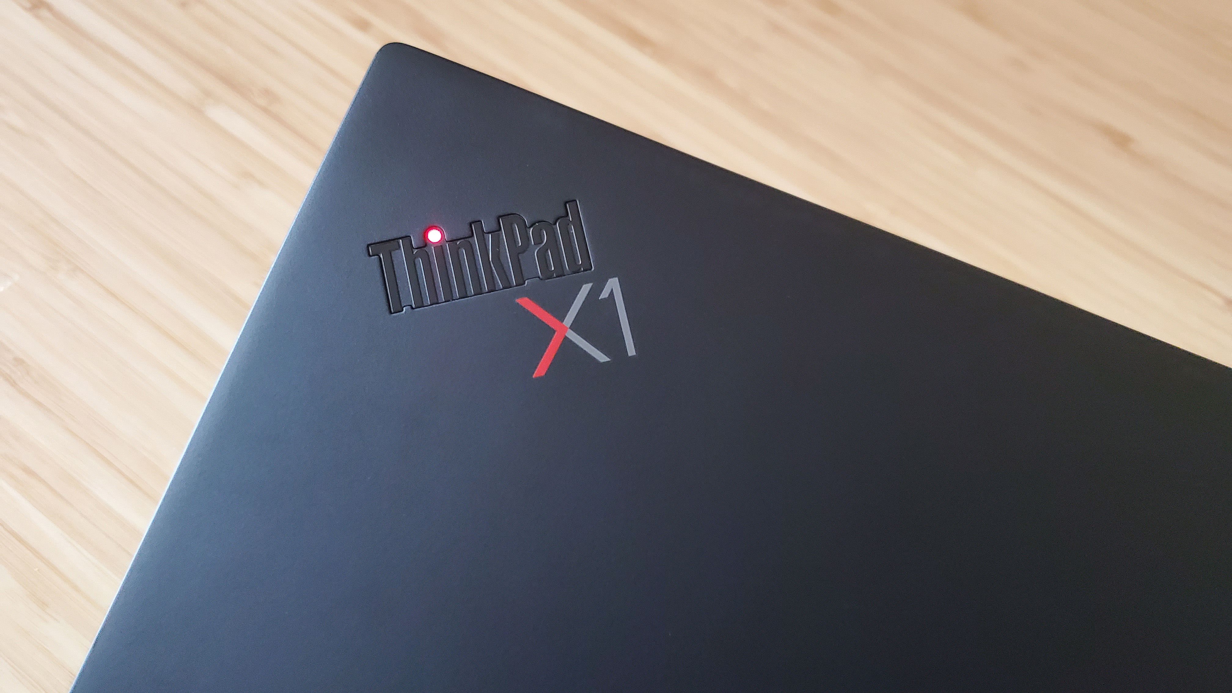 The Lenovo ThinkPad X1 Carbon laptop closed on a desk.