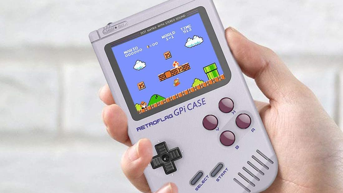 Person's hand holding a Retroflag GPi handheld gaming case.