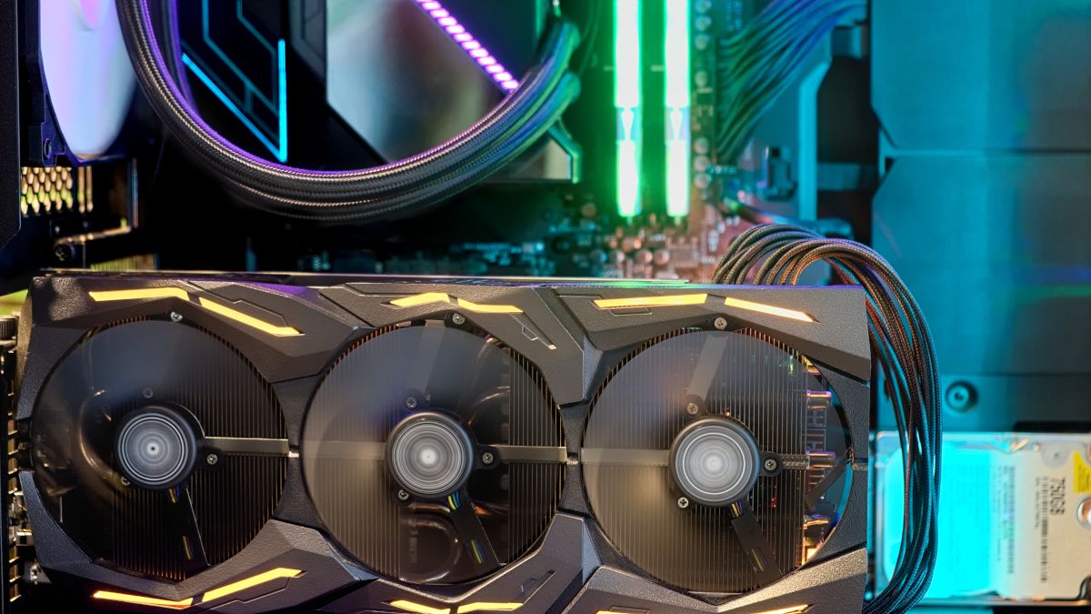 Closeup of a GPU operating inside a PC gaming rig with RGB lighting.